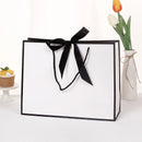 10pcs/lot High Quality Pretty Pink Gift Bag Gift Box Ornament Pajama Book Black Handle With Ribbon Paper Box Bag Kraft Packaging