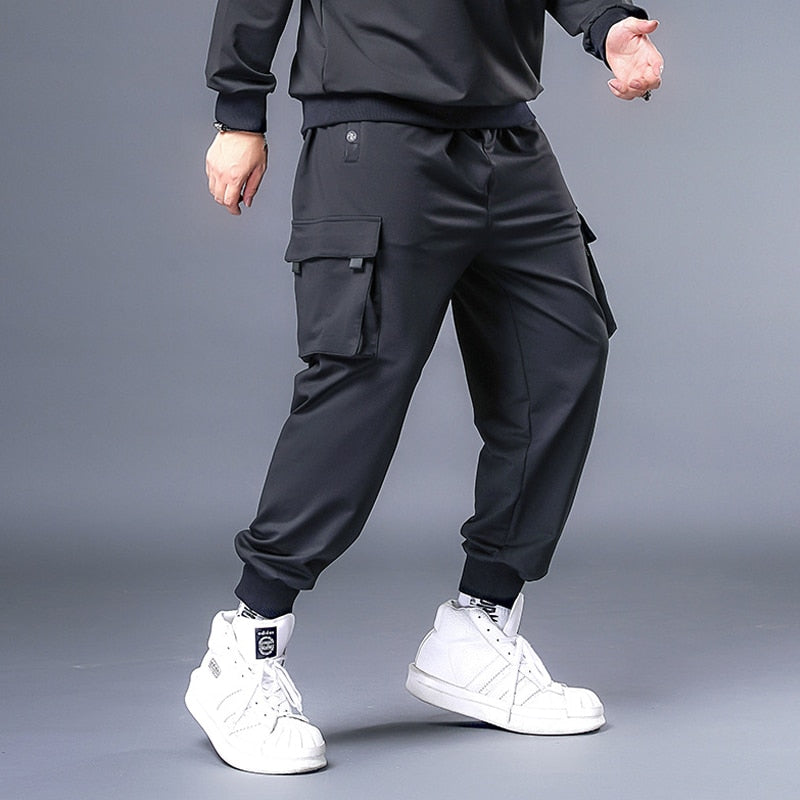 Pantalones holgados para hombre, ropa informal estilo Hip Hop, pantalones Cargo de talla grande 7XL, pantalones de chándal para hombre, pantalones de moda de gran tamaño para correr, pantalones de talla grande HX530