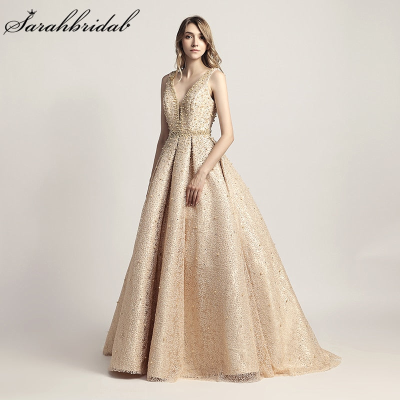 Luxus-Abendkleider lang Dubai Arabisch A-Linie Perle Backless Partykleider bodenlangen ärmellosen formalen Robe de Soiree LX442