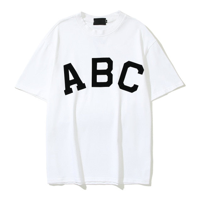 Kanye West Spoof Asimétrico Hombres Verano 350 Camisetas Hip Hop Streetwear Caqui Oversized Tops Camisetas Casual Carta Imprimir Camisetas